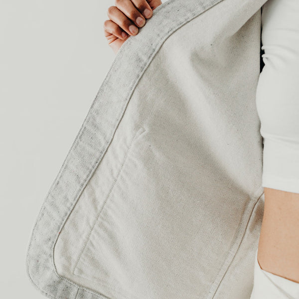 cropped image of the inside of the front panel of a denim artist jacket