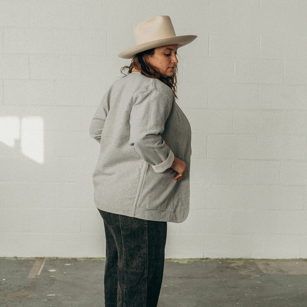 back and side view of woman wearing the denim artist jacket