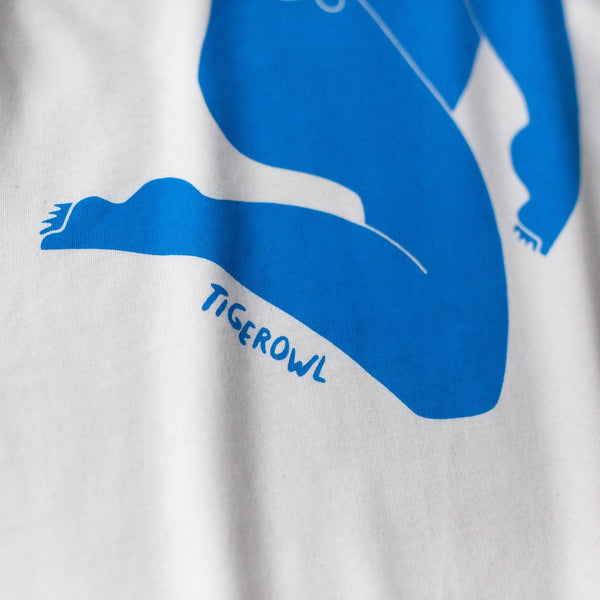 detail view of a blue t shirt graphic with the word "tigerowl"