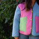 cropped image of woman wearing multicolored cropped quilted coat