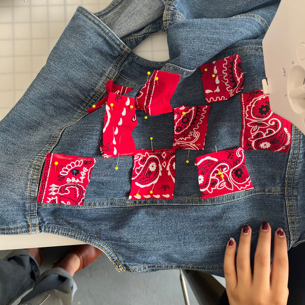 Denim jacket with red bandana patches